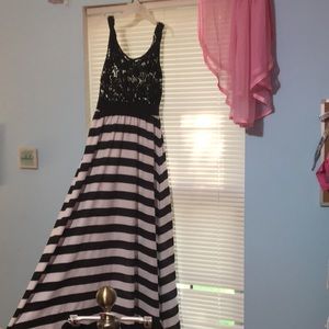 Black and white striped dress. Floor length.